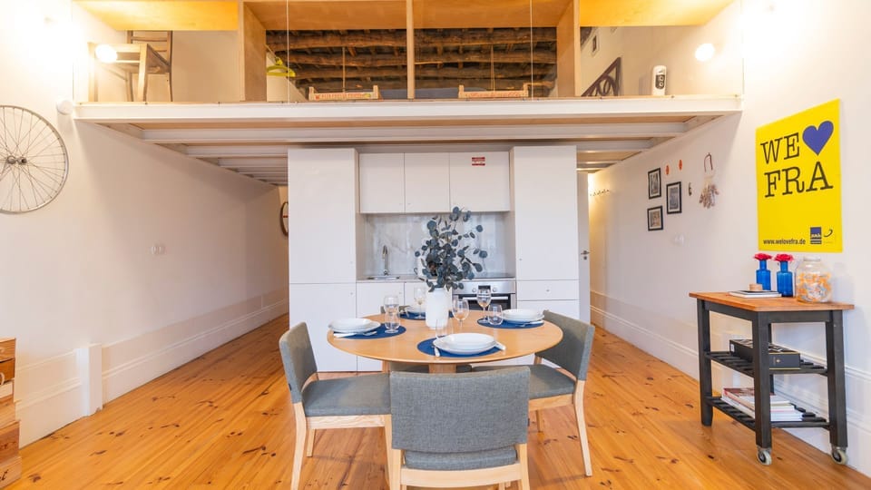 A large dining table takes center stage. It's the perfect setting for intimate dinners, entertaining guests or simply enjoying a meal in comfort #airbnb #spacious