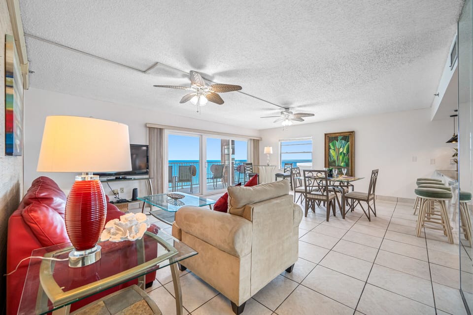 Living room area, looking towards dinner table and open air balcony.  