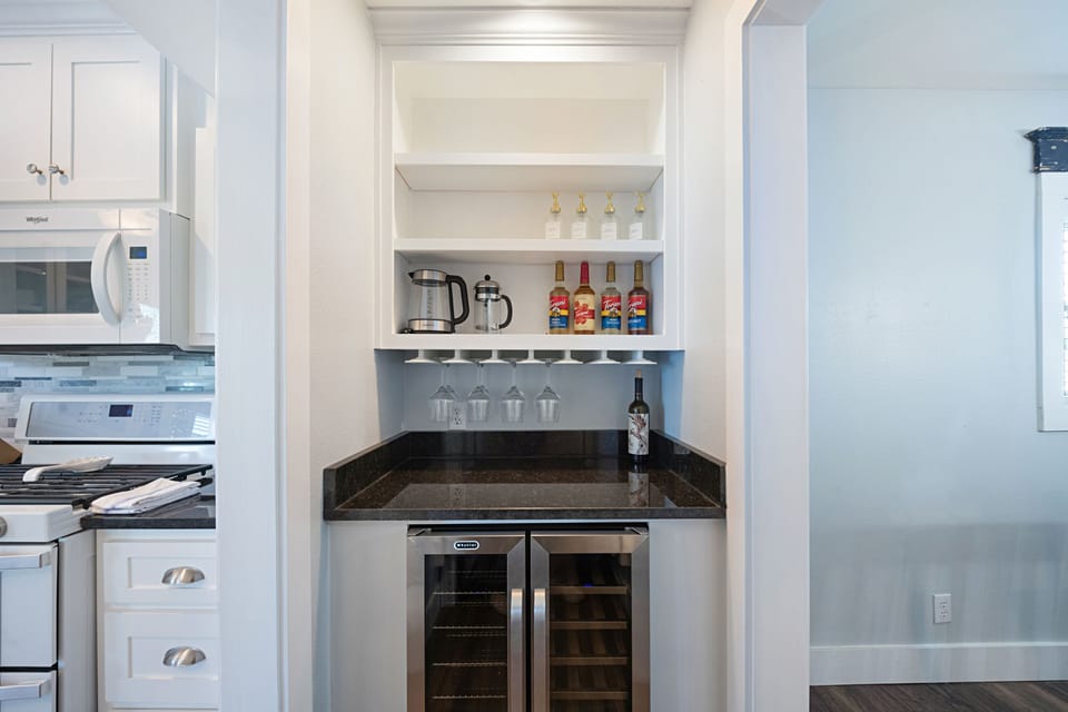 The French press and wine fridge are just around the corner to the dining room.