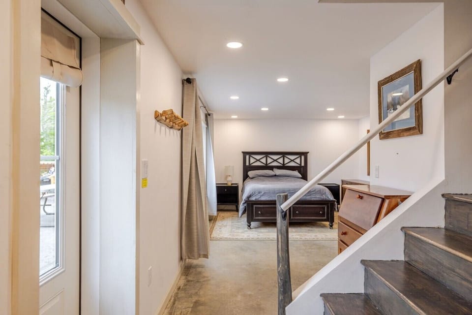 Bedroom 5 on walkout basement level, with bathroom attached, and washer dryer