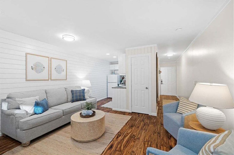 Unwind in this elegant room with soft accents.