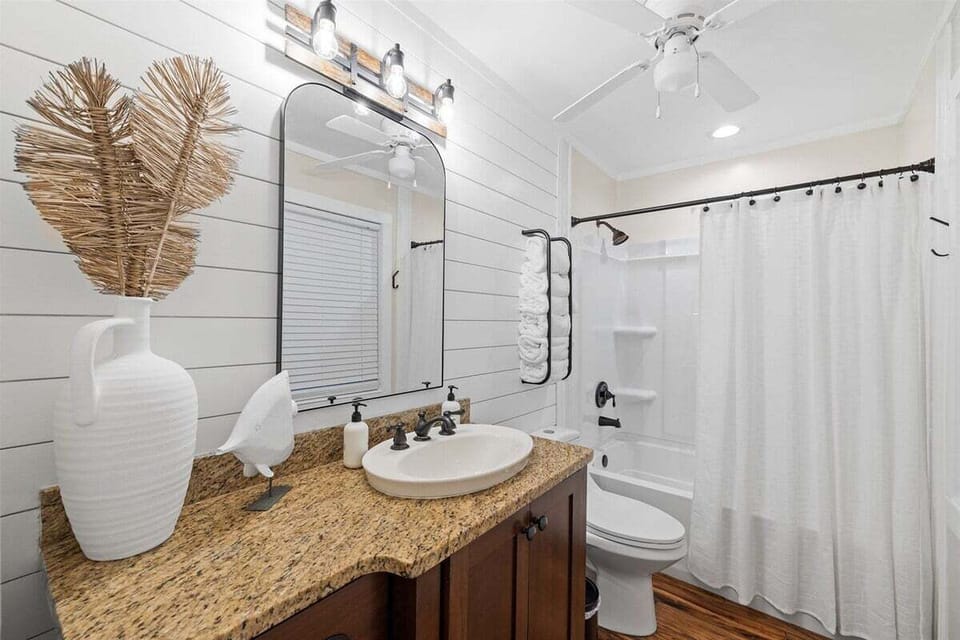 Refresh and relax in this sleek, well-appointed bathroom.