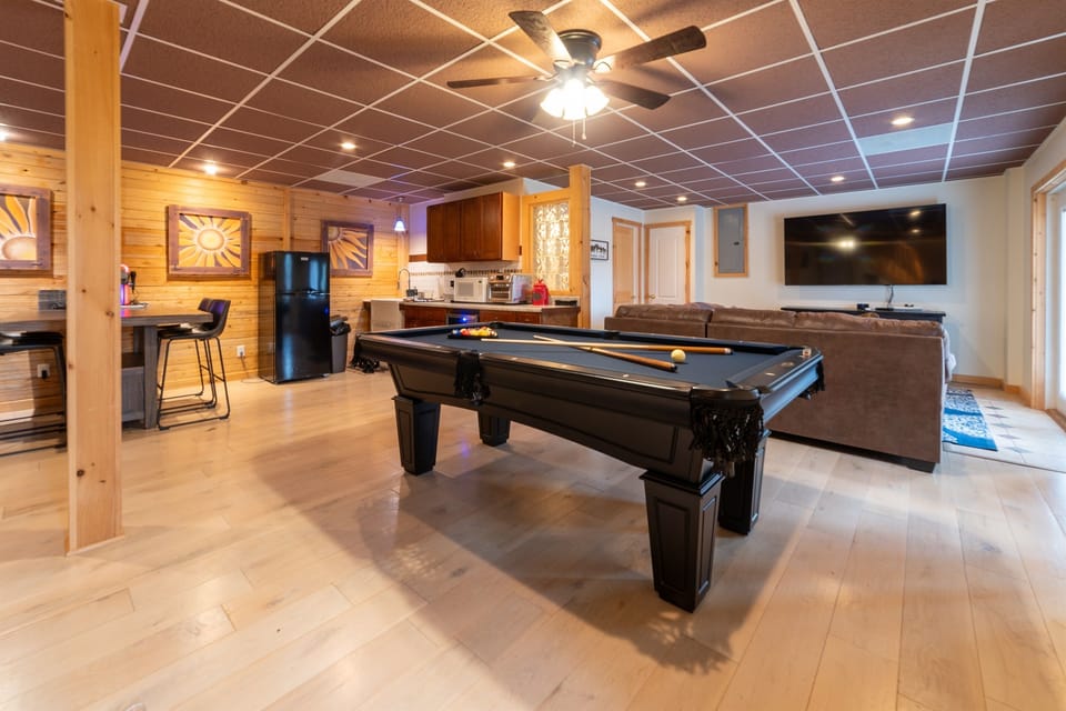 Pool Table and game area with 75" TV