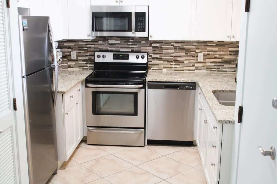 Full Kitchen and Washer Dryer to the left is stackable unit.