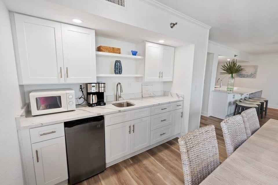 Wetbar with mini fridge and double coffee maker.  You can use K-cups or make pot coffee.  Lots of storage for extra food.  