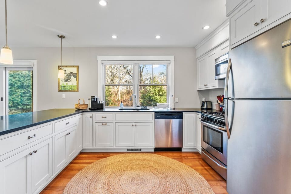 The kitchen comes complete with stainless steel appliances.