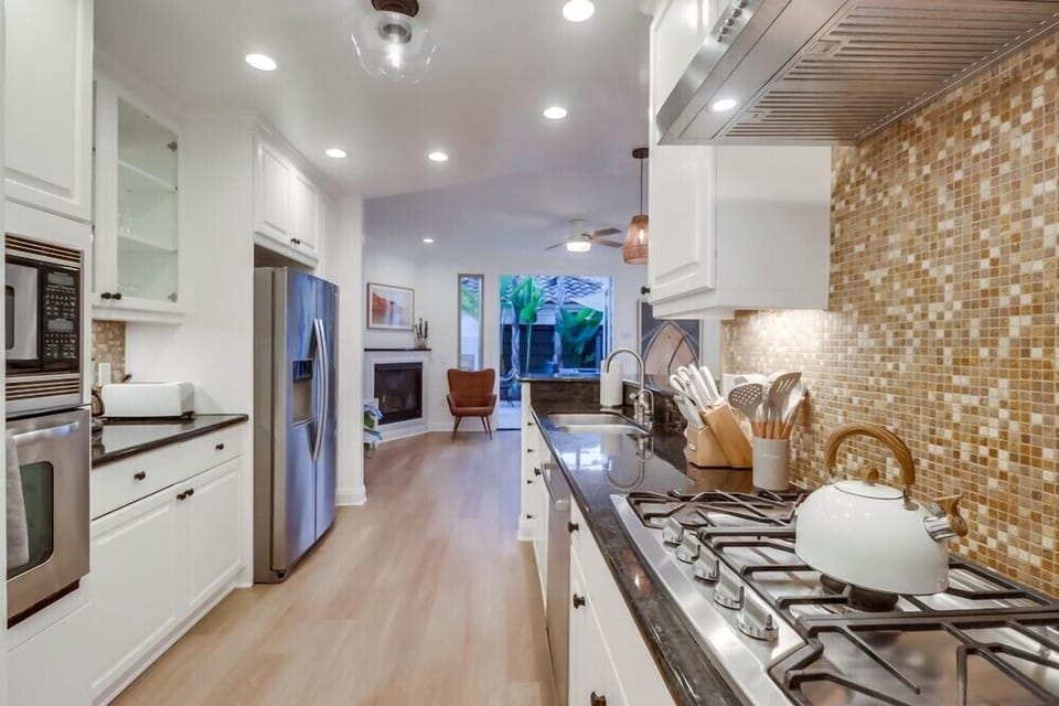 The kitchen is equipped with a gas stove, giving you precise heat control for everything from quick breakfasts to full family dinners.