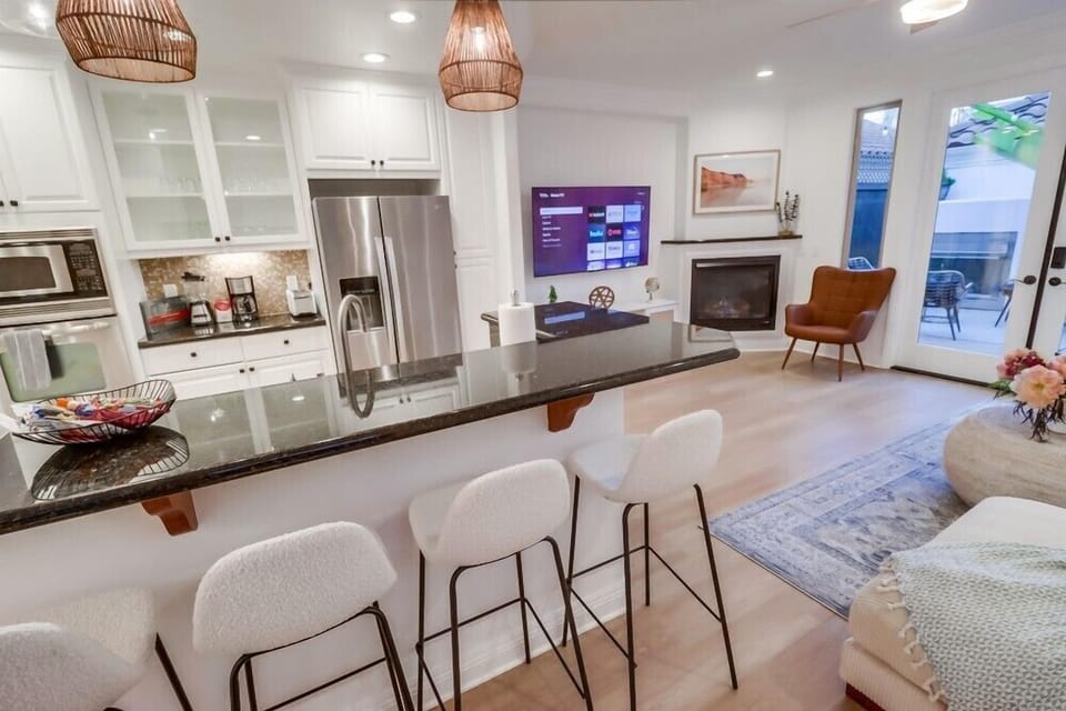 Gather at the kitchen bar with seating for 4, a casual spot for morning coffee, afternoon snacks, or evening cocktails while dinner comes together.