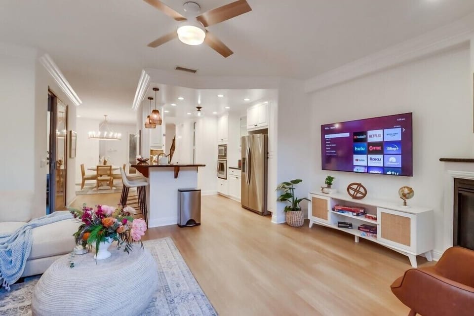 The open layout offers seamless access to the kitchen from the living room, making it easy to cook, gather, and stay connected.