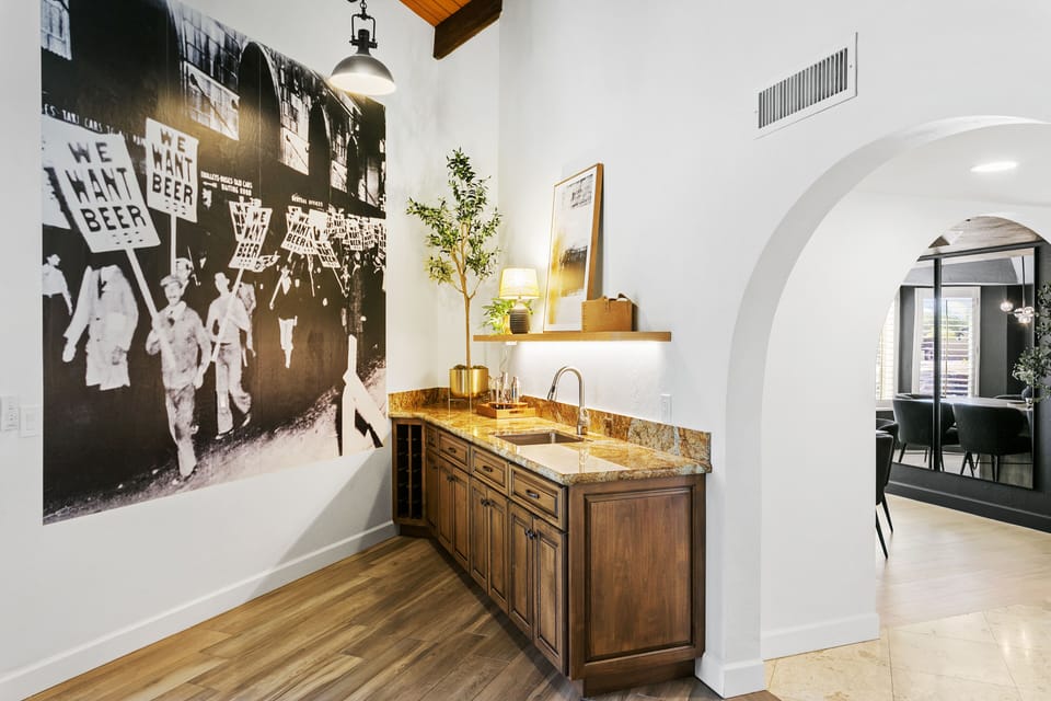Full bar area with a cool wall mural accent for added flair