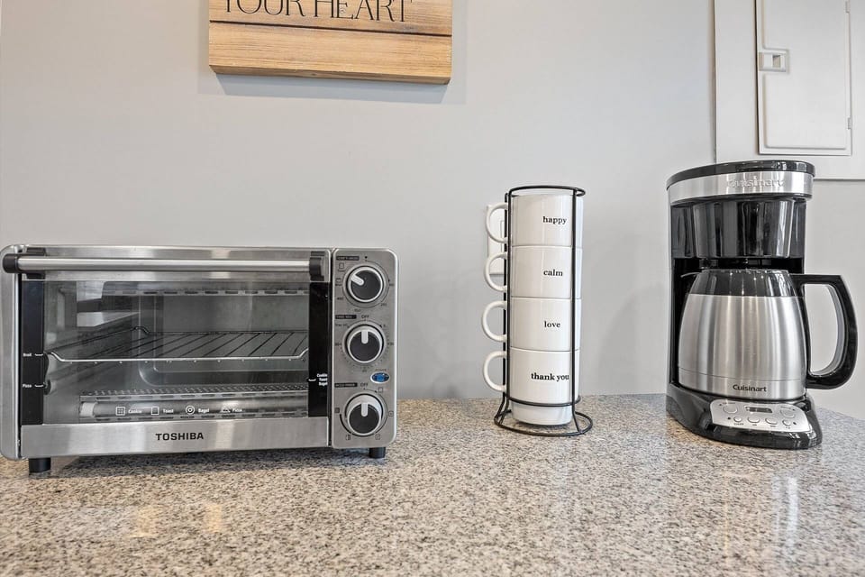 Toaster oven and coffee maker on small island in the kitchen