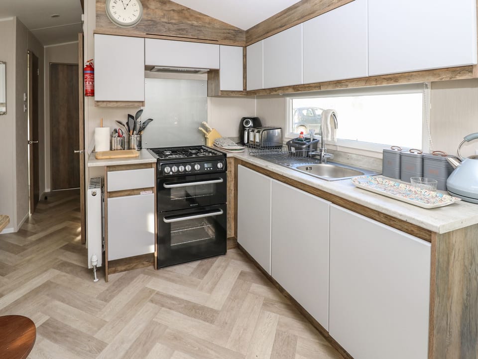 Fridge, electric kettle, toaster, cookware/dishes/utensils