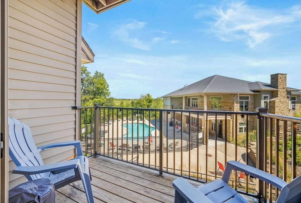 Sip morning coffee or evening wine on your private balcony with seating for two. Enjoy fresh air, treetop views, and a peek at the sparkling pool below—a perfect extension of your stay.