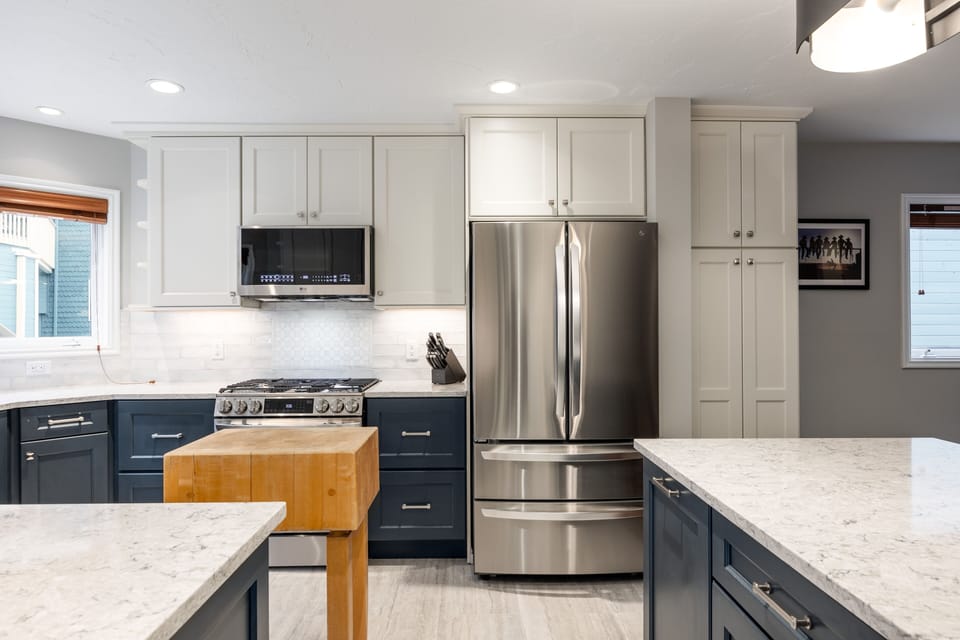 - Cook in this stylish kitchen with gleaming quartz countertops
- Enjoy exclusive features including a gas range, French door fridge, and butcher block island
- Bask in natural light while prepping meals in a space that's both elegant and functional