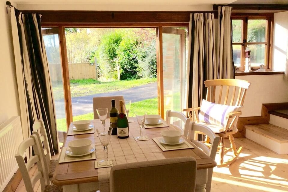 Sunny kitchen dining area with direct access onto garden