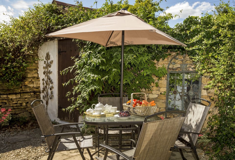 Alfresco entertaining in the fully enclosed patio garden to the rear