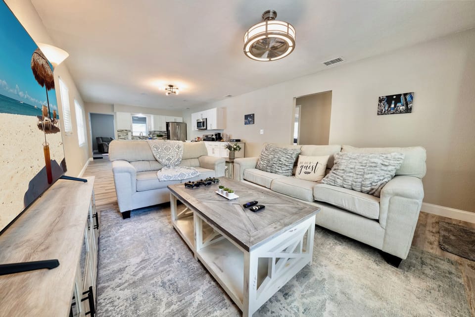 The centerpiece of this inviting space is our plush cream-colored couch, beckoning you to sink in and relax.