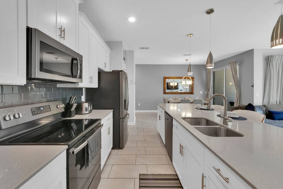The open kitchen area is fully equipped for you to cook during your stay