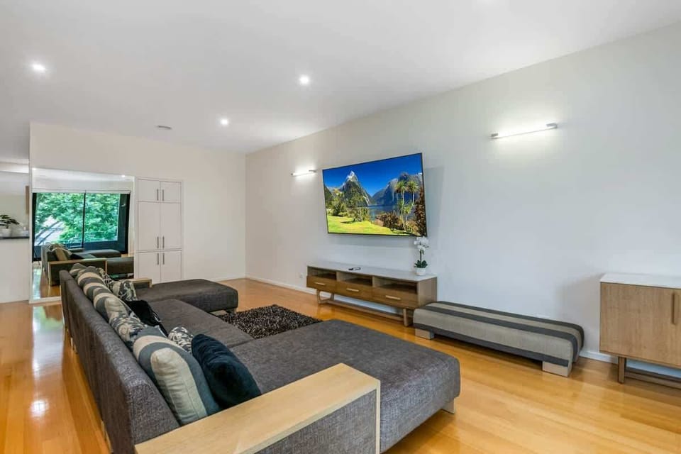 Spacious living room with flat screen TV.