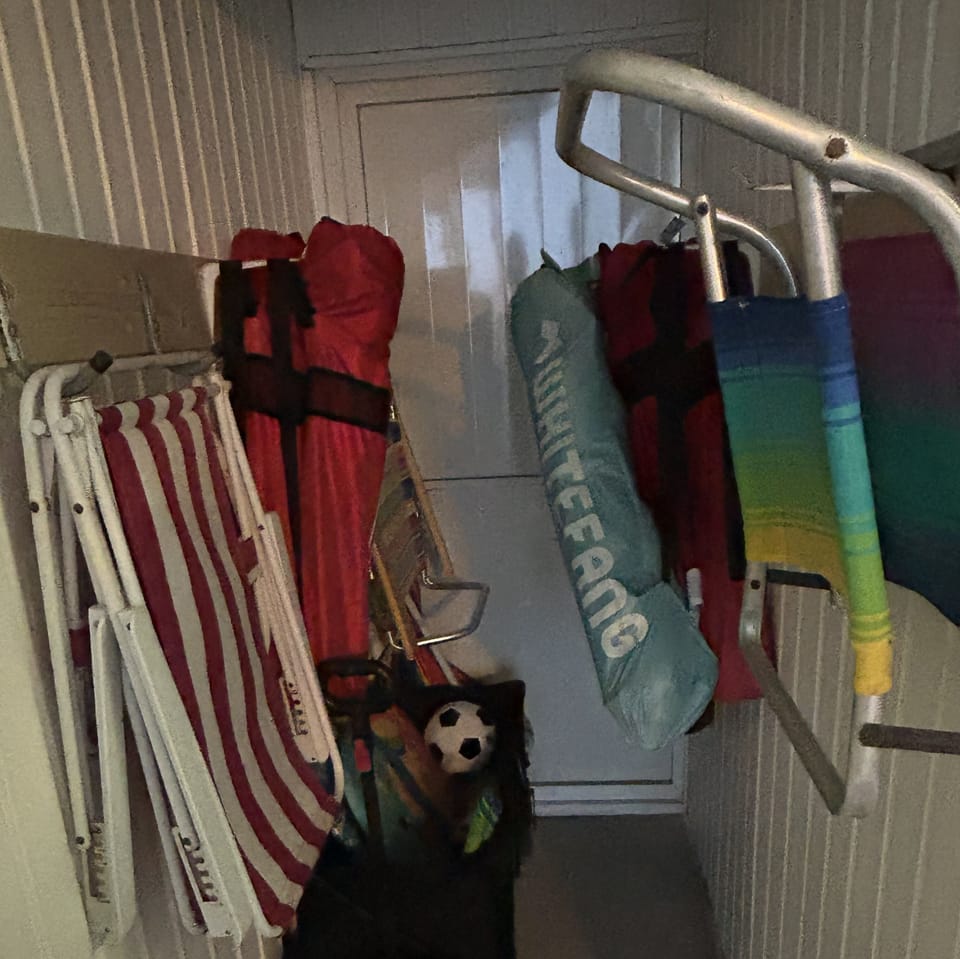 Beach toy closet with beach chairs + beach cart + toys