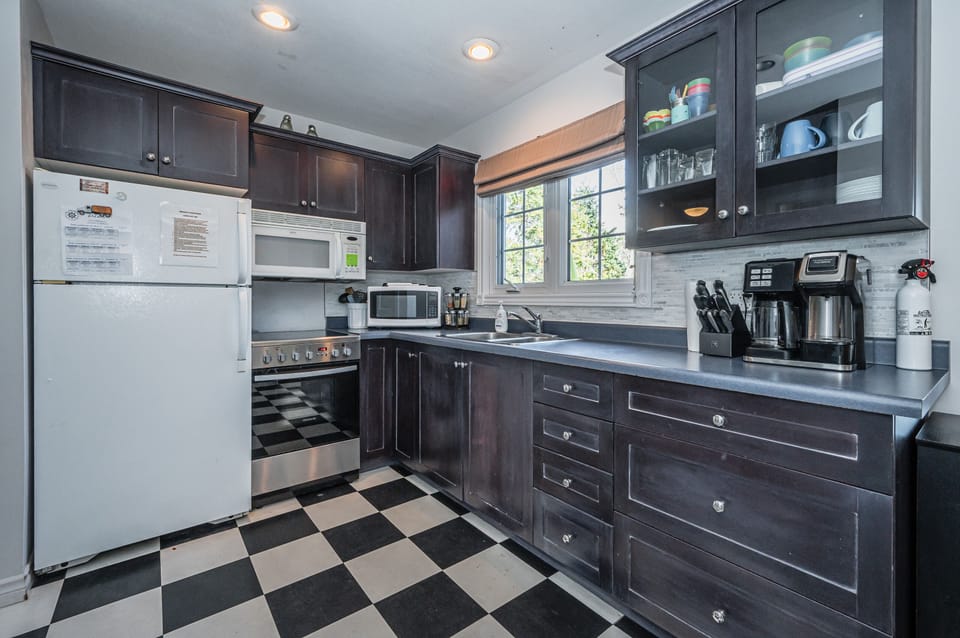 Prepare delicious meals in the fully-equipped, modern kitchen, complete with useful appliances and sleek countertops. Cooking becomes a joy in this stylish culinary space.