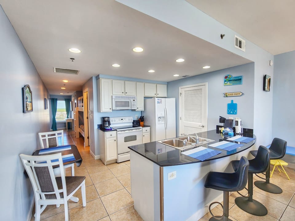 Fully equipped kitchen with granite countertops and full size appliances 