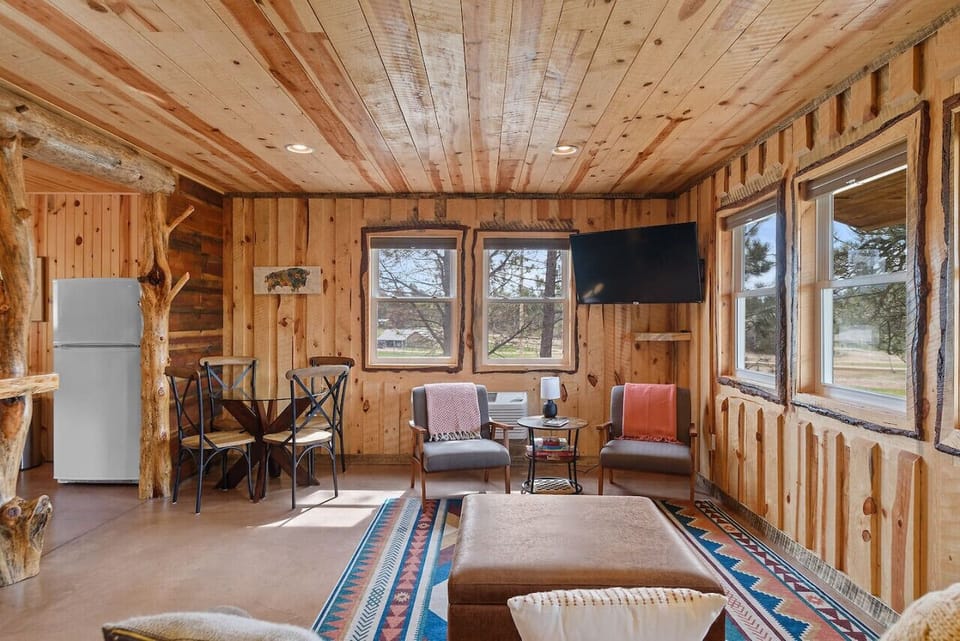 The living area has comfy couch and a Roku TV with all available streaming services as well as several board games.