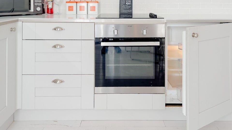 Appreciate the thoughtful design and functionality of our kitchen, enhancing your stay.