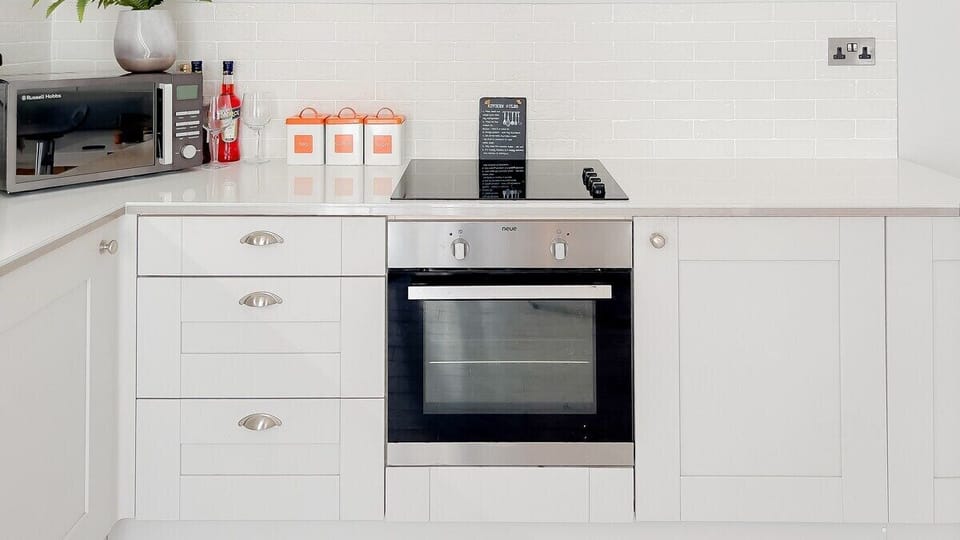 Immerse yourself in the clean lines and sophisticated design of our kitchen.