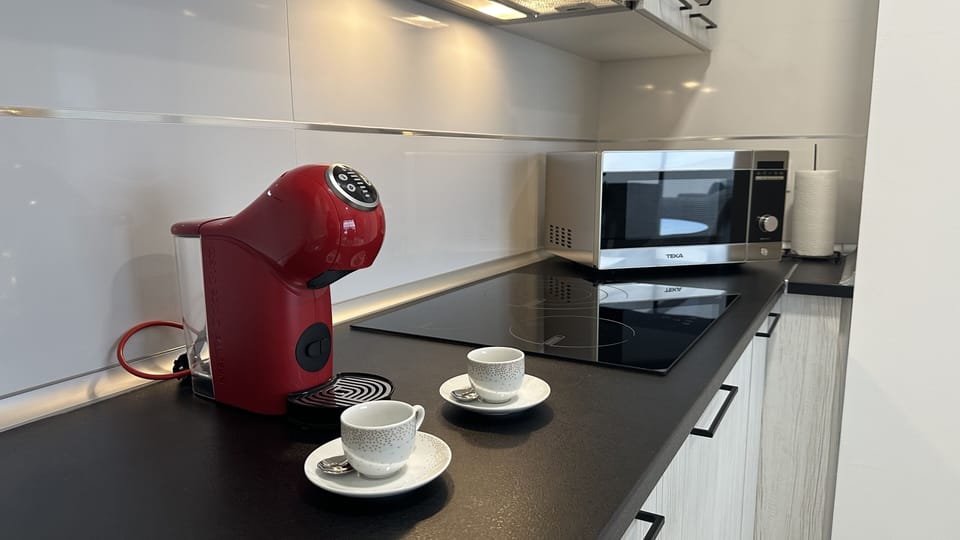 coffee maker (Dolce Gusto), kettle, ceramic hob, and all cooking essentials.