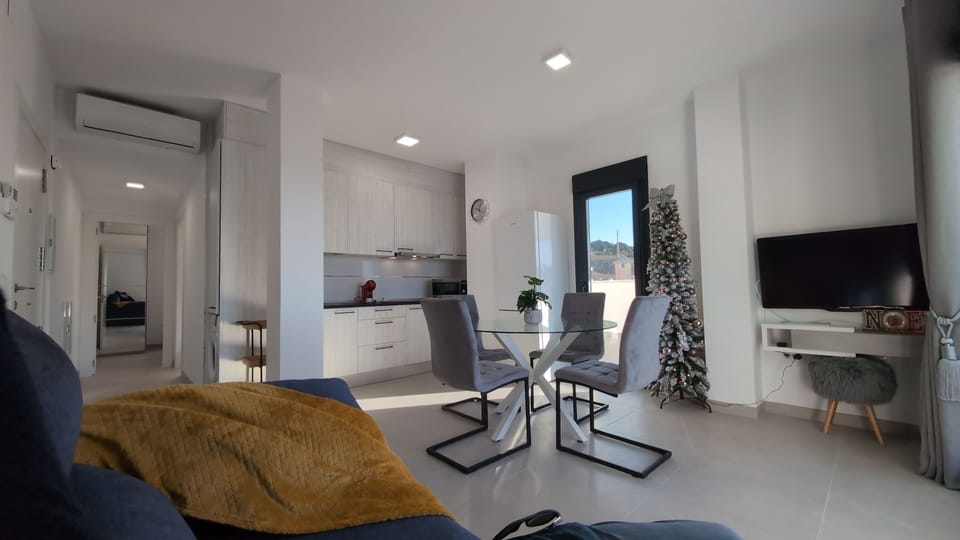 Living room with air conditioning and television