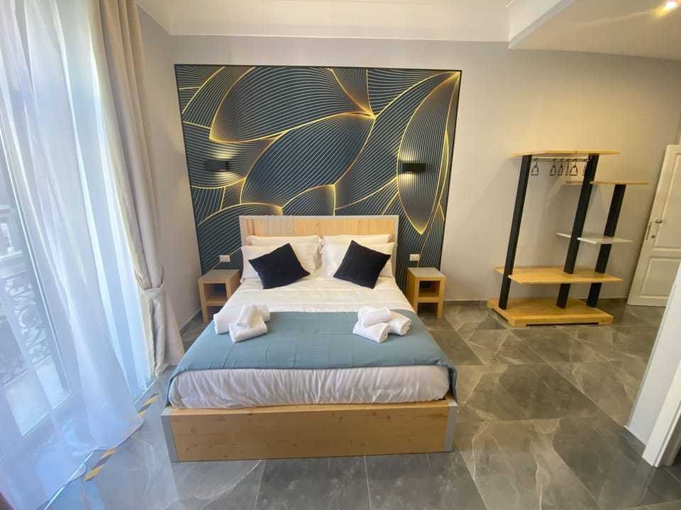 Deluxe Room | 1 bedroom, down comforters, desk, laptop workspace