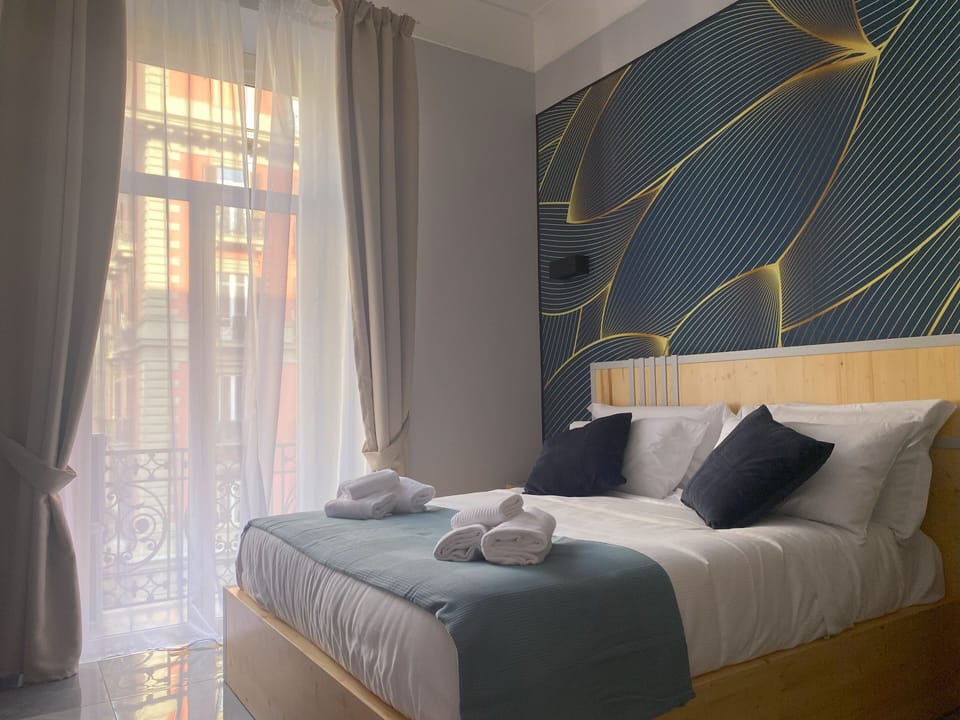 Deluxe Room | 1 bedroom, down comforters, desk, laptop workspace