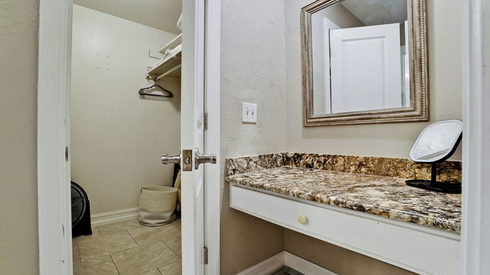 Desk area in between the main bedroom and bathroom