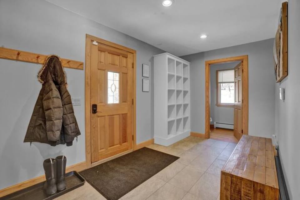 Mudroom entry and half bath. Plenty of space for skis, boots, and outdoor gear.