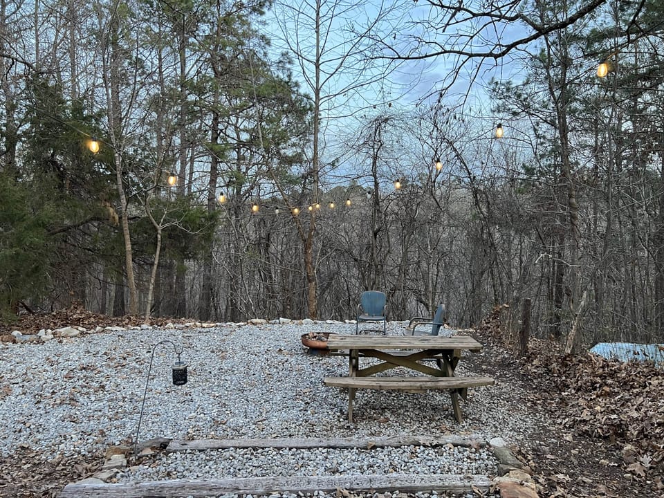View of Camp 2 with added gravel seating area and string lights (Jan '26)