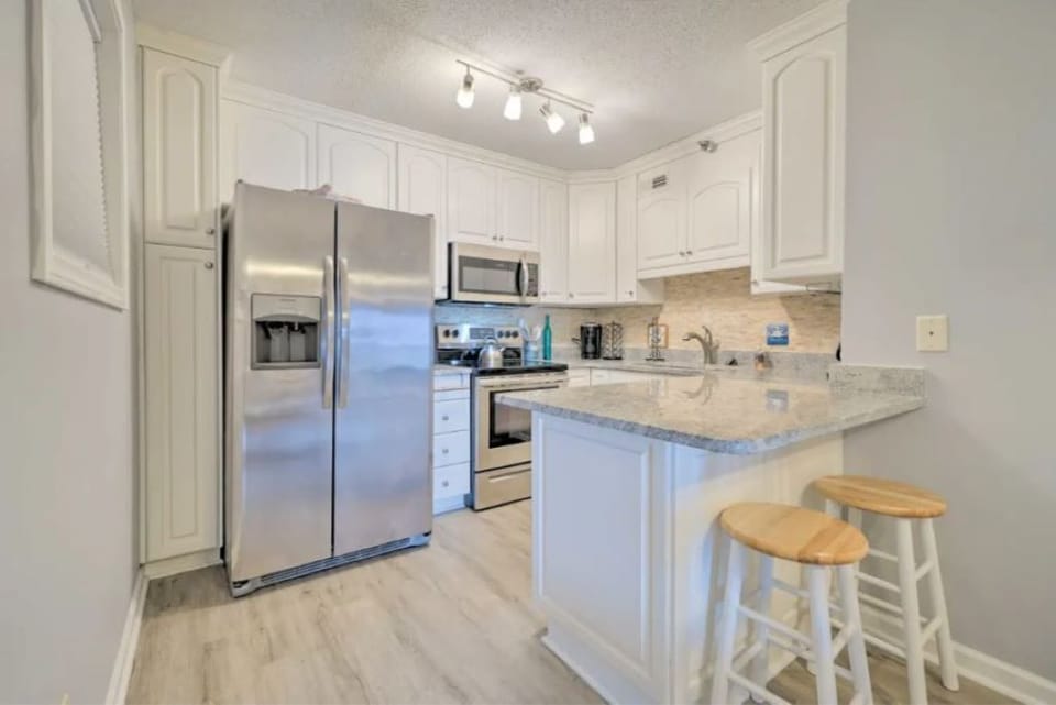 Full Kitchen equipped with coffee maker, all cooking essentials and dish washer.