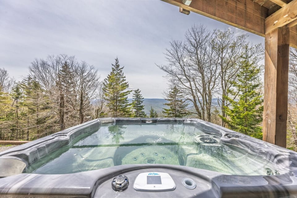 Unwind in the hot tub while watching the sunset over the mountains