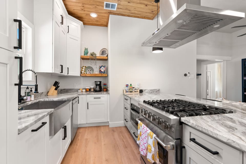 Fully stocked kitchen with modern, gas stove, perfect cooking haven!