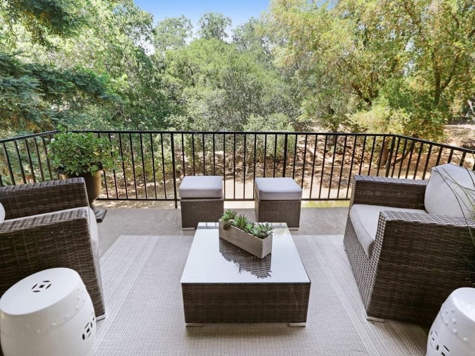 Balcony overlooking creek and golf course beyond