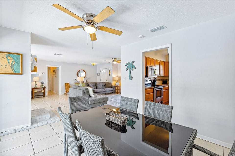 Bright, open dining space blends comfort with modern charm!