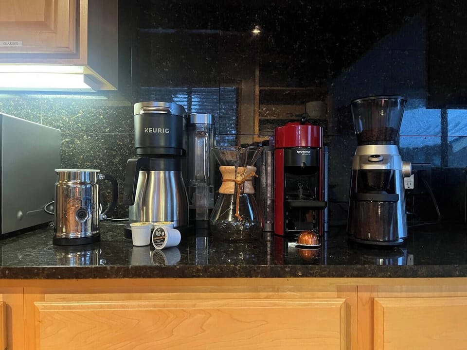 A coffee lovers dream! Keurig drip coffee, Nespresso, pour over, and coffee grinder available for our guests. 