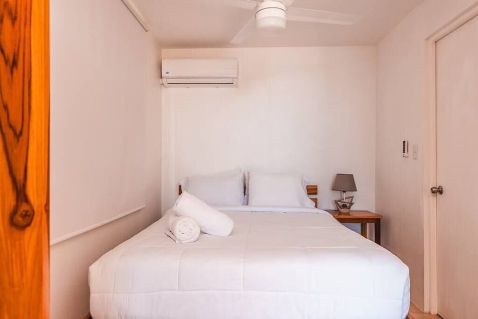 Queen bed with A/C and fan