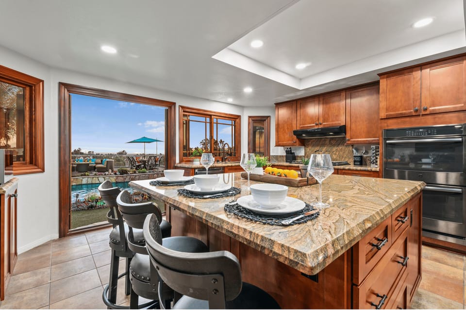 Easily serve up meals with the family in this stunning kitchen!
