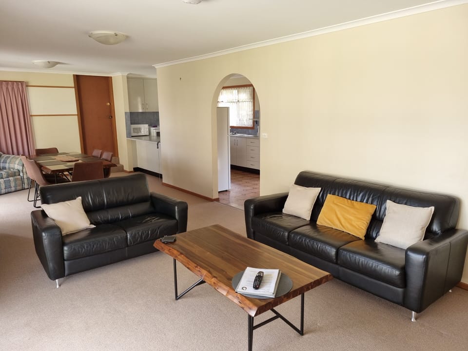 Family Apartment, 2 Bedrooms, Garden View | Living area | 55-inch Smart TV with digital channels, TV