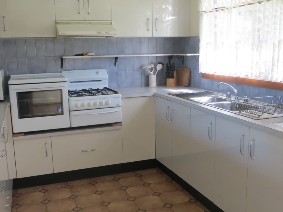 Family Apartment, 2 Bedrooms, Garden View | Private kitchen | Full-size fridge, microwave, oven, stovetop