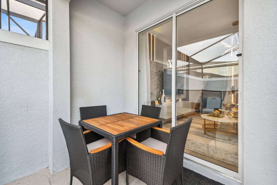 Experience your private oasis featuring a sleek pool and spacious patio, ideal for sunbathing. With modern safety fencing for peace of mind and an expansive blue sky, it’s the perfect setting for ultimate relaxation.
