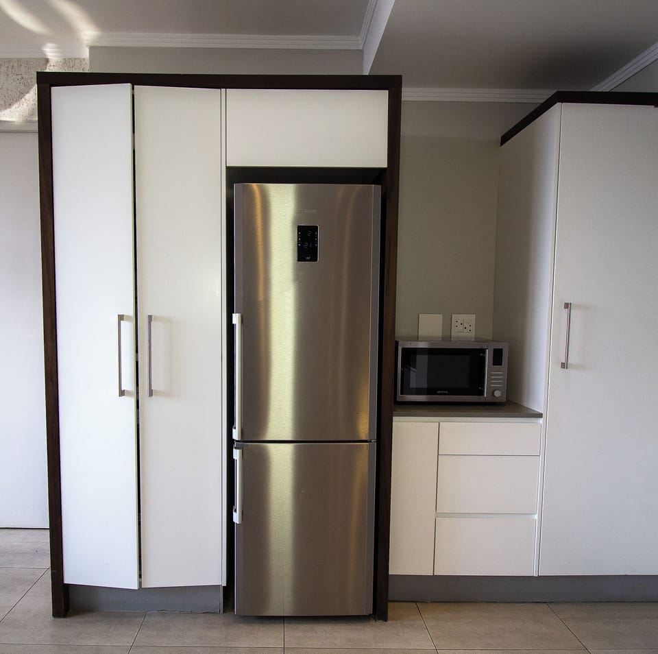 Luxury Apartment | Private kitchen | Full-size fridge, microwave, oven, stovetop