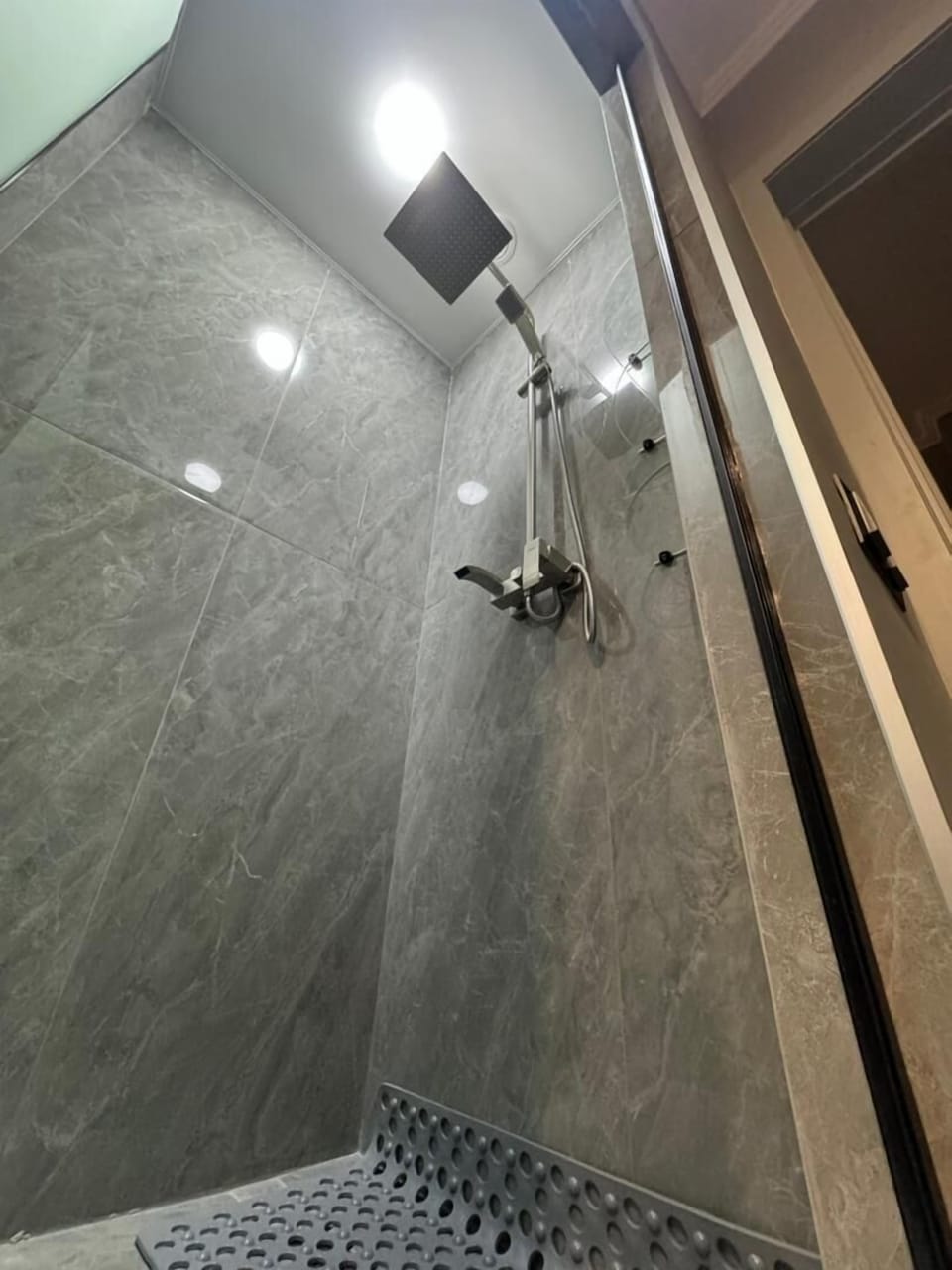 Rainfall showerhead, designer toiletries, hair dryer, slippers