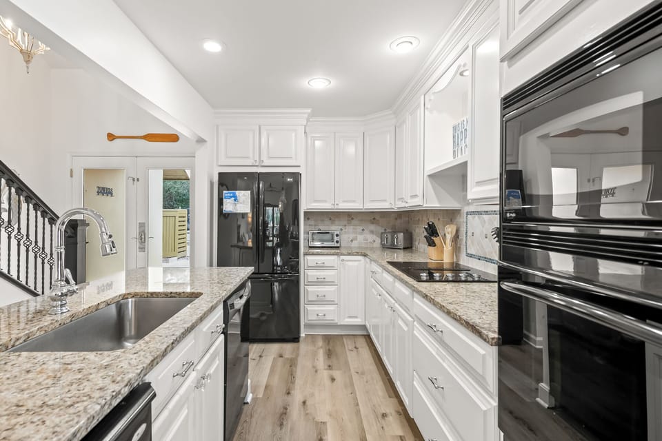 Kitchen includes granite countertops.